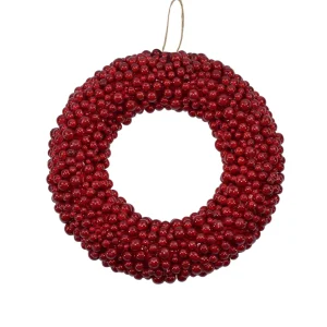Corona con bacche rosse per fuoriporta natalizio